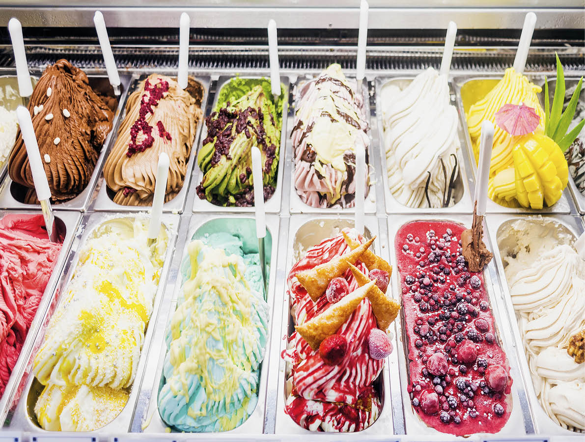 A display case filled with various flavors of ice cream. AI generated content