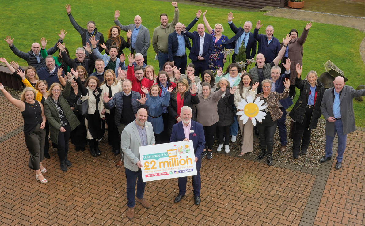 A group of people are posing for a photo in front of a sign that says “25 years". AI generated content
