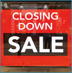 A window display advertising a closing down sale. AI generated content