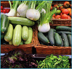 A variety of vegetables are displayed in baskets, including cucumbers, tomatoes, and radishes. AI generated content