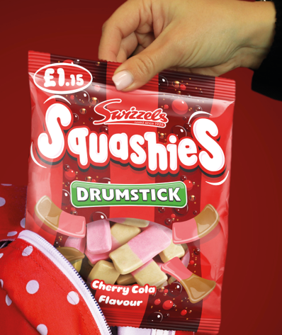 A hand holds a bag of Squashies drumsticks. AI generated content