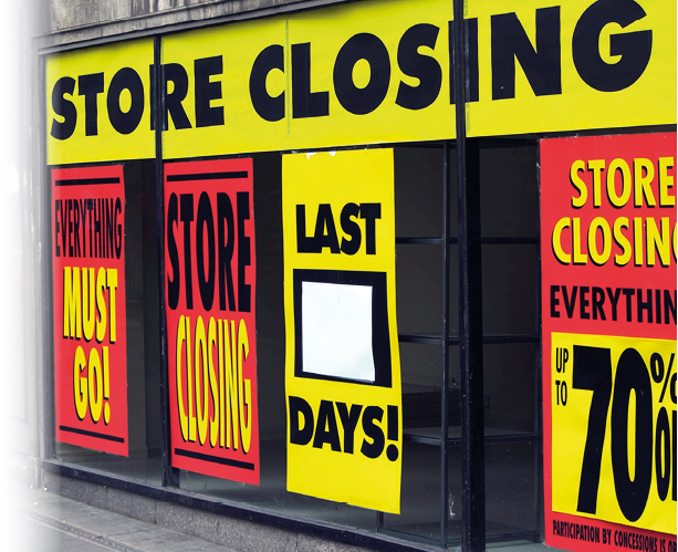 Store front windows display signs for closing sales. AI generated content