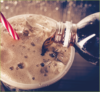 Refreshing Bubbly Soda Pop with Ice Cubes. Cold soda iced drink in a glasses - Selective focus, shallow DOF.