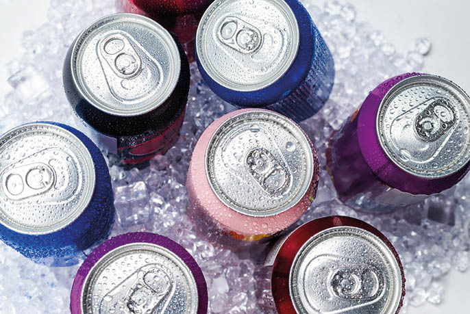 Group of aluminium cans in ice, cold drink. Top view.