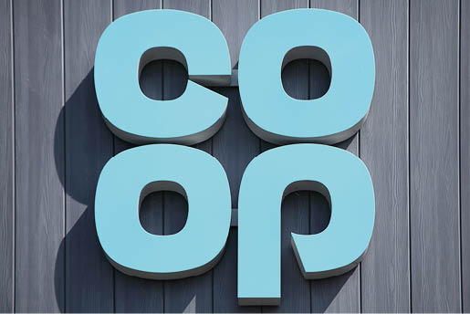 Burry Port, Wales, UK, July 1, 2017 : Co Op logo advertising sign outside one of  its retail supermarket stores in the town centre