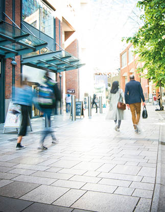 Anonymous shoppers walking on a shopping high street