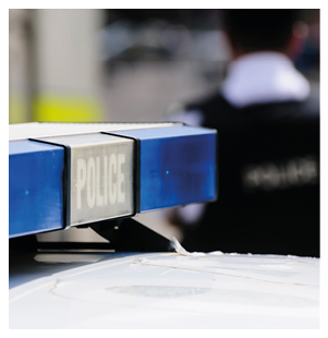 Blue lights on the roof of a police vehicle