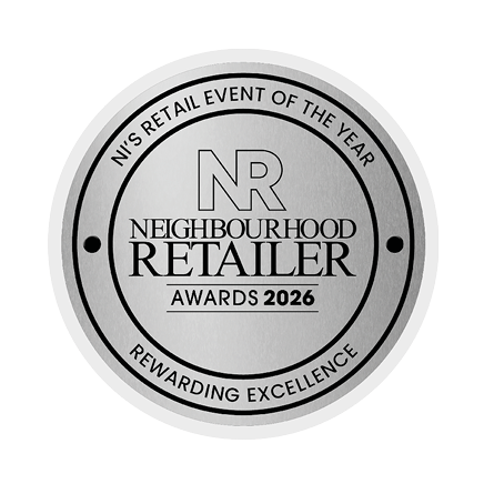 A silver award for the best neighborhood retailer of the year. Description generated by AI