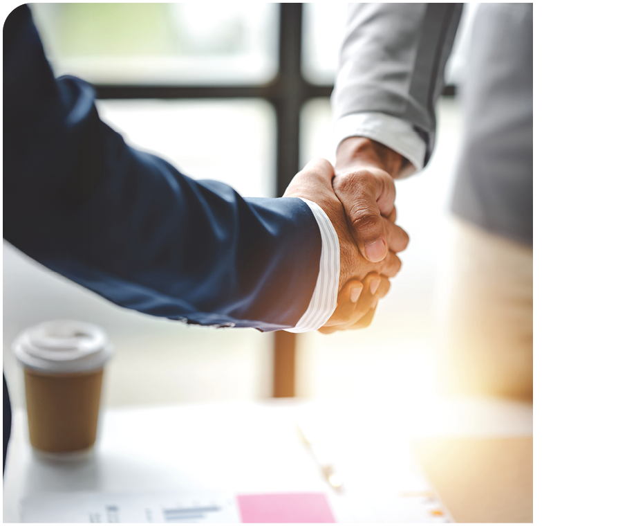 Two men shaking hands. Description generated by AI