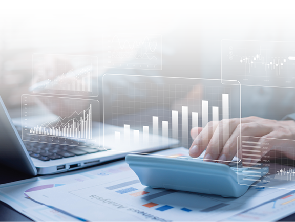 A man is using a laptop with graphs on the screen. Description generated by AI