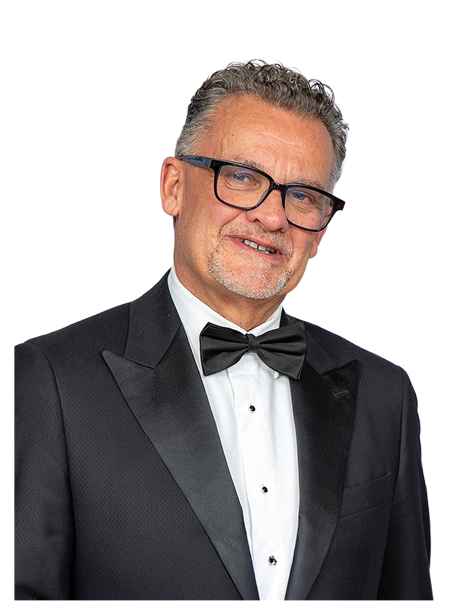 A man wearing a suit and bow tie. Description generated by AI