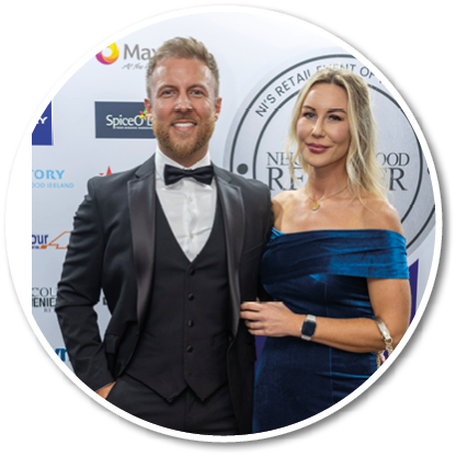 A man and woman standing together. Description generated by AI
