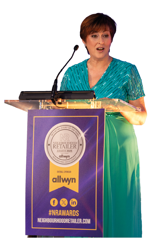 A woman in a blue dress is standing behind a podium. Description generated by AI