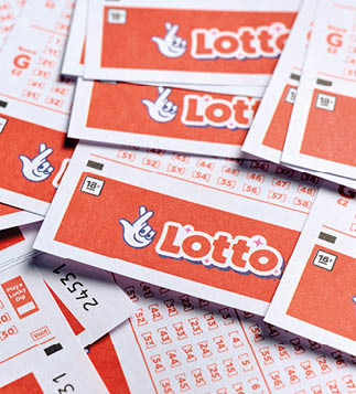A stack of red and white lotto tickets. Description generated by AI
