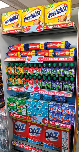 A display of cereal boxes and bottled water. Description generated by AI