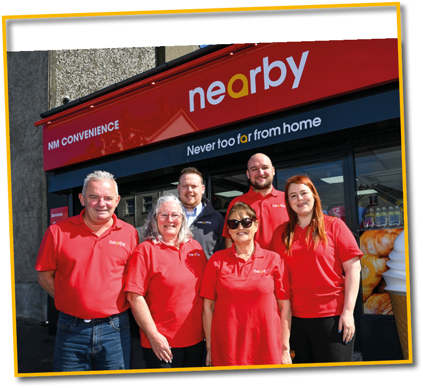 A group of people standing in front of a store. Description generated by AI