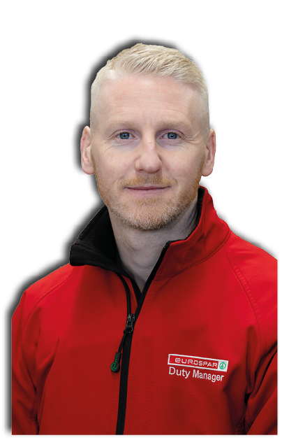 A man wearing a red jacket with a black collar. Description generated by AI