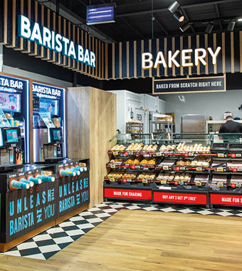 A bakery with a sign that says “Barista Bar." Description generated by AI