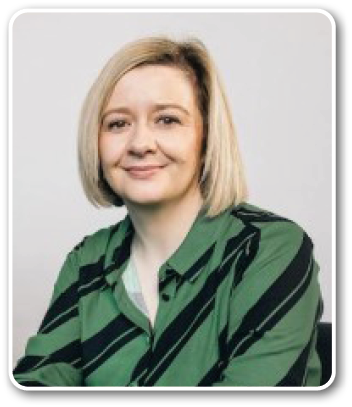 A woman wearing a green shirt. Description generated by AI