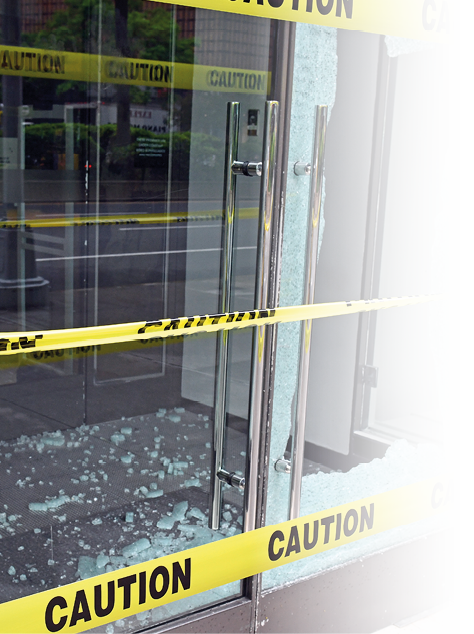 A broken window with a yellow caution tape around it. AI generated content