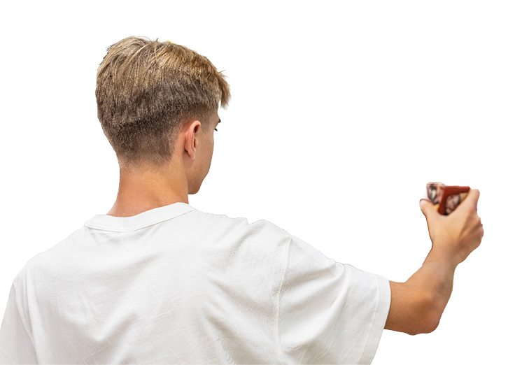 A man holding a red object. Description generated by AI