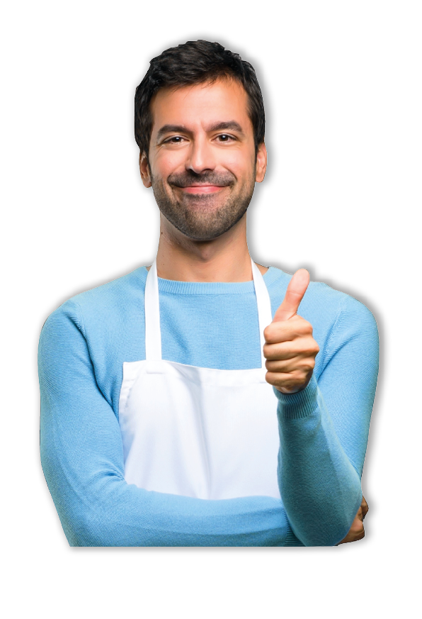 Man wearing an apron giving a thumbs up gesture and smiling because something good has happened in a bakery
