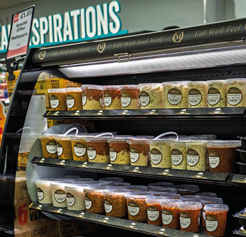 A refrigerator with food in it. Description generated by AI