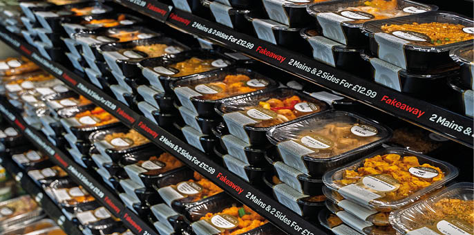 A display case filled with various foods. Description generated by AI
