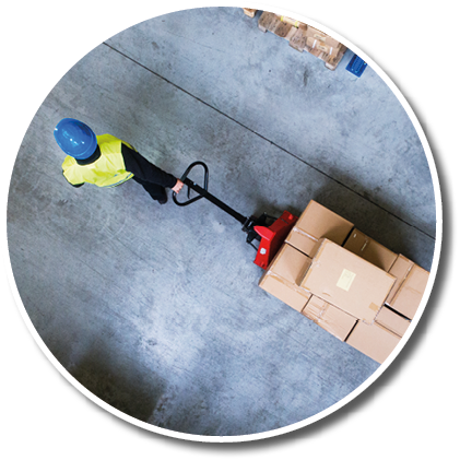 Male warehouse worker pulling a pallet truck.