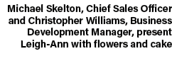 Michael Skelton, Chief Sales Officer and Christopher Williams, Business Development Manager, present Leigh Ann with f...