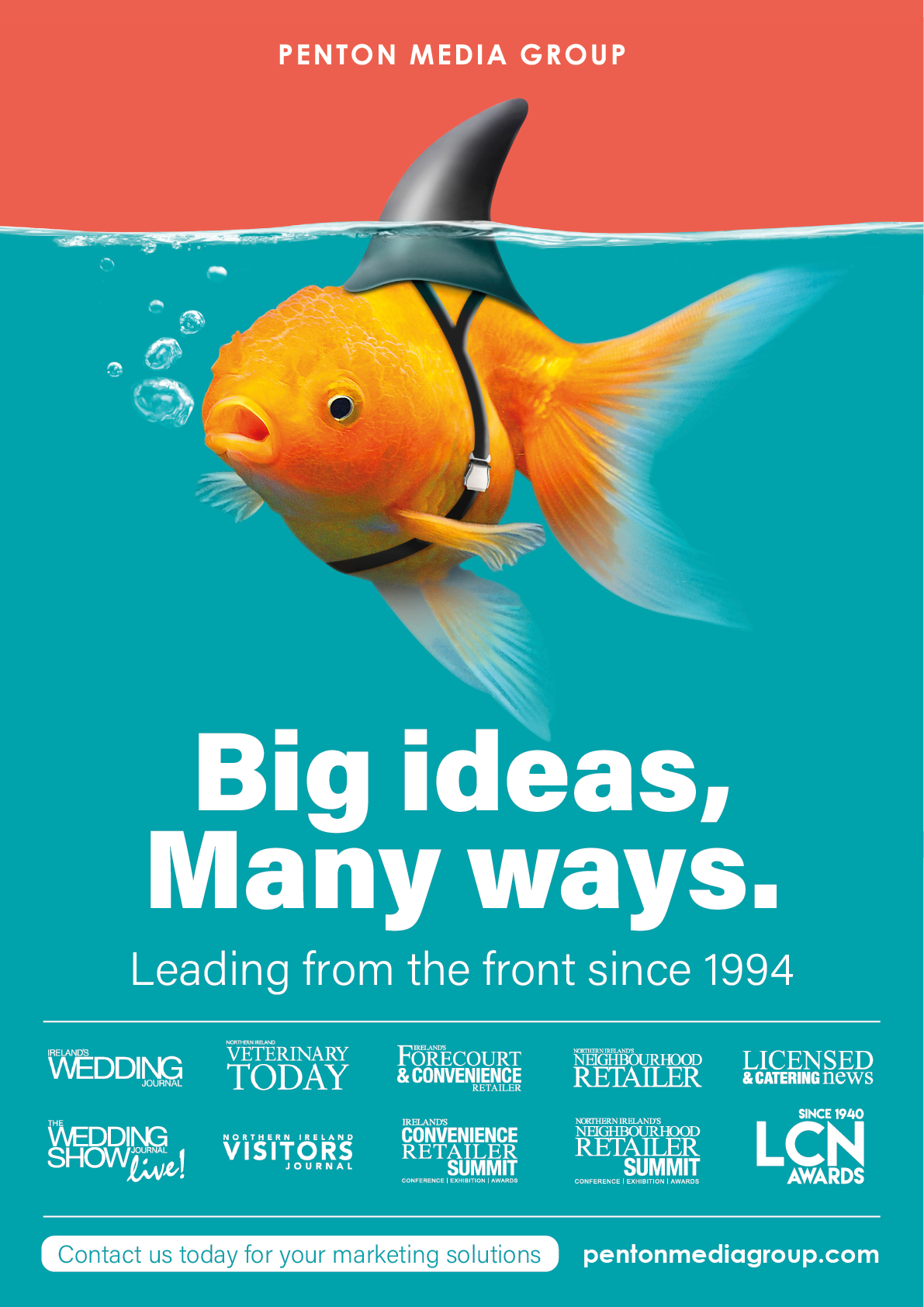 A goldfish wearing a shark fin harness swims underwater with the text promoting Penton Media Group's marketing solutions and their slogan about big ideas and leadership since 1994. Description generated by AI