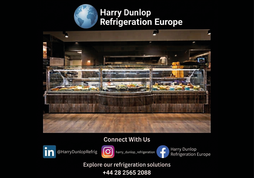 A well-lit food display counter in a restaurant or cafeteria showcasing a variety of dishes behind glass panels. Description generated by AI