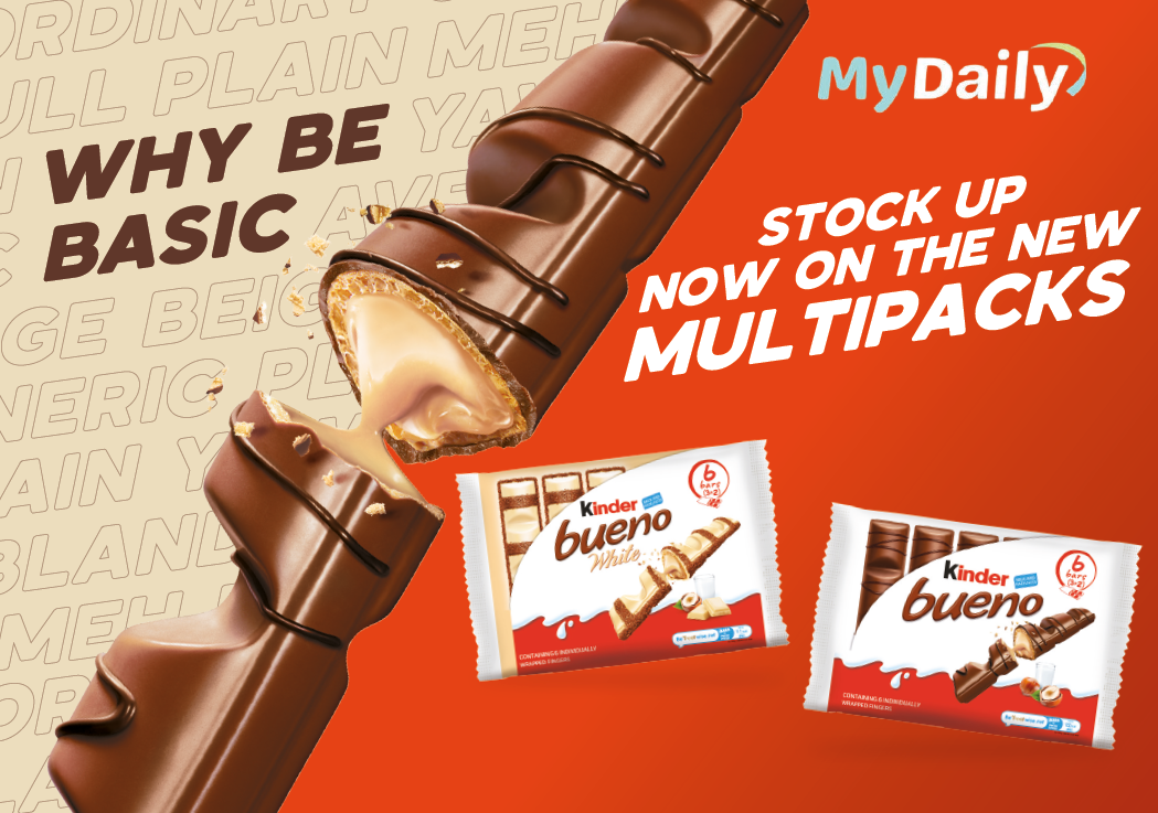 A promotional graphic for Kinder Bueno chocolate bars featuring a close-up of a broken chocolate bar with creamy filling and text encouraging stocking up on new multipacks. Description generated by AI