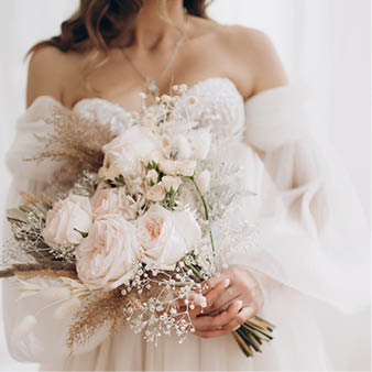 bride holding gentle wedding bouquet