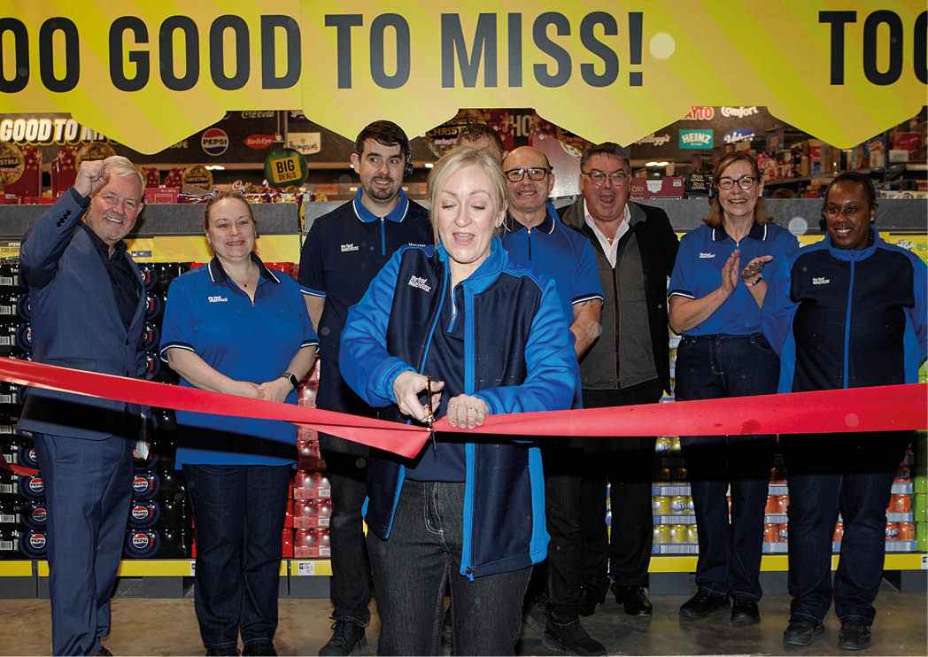 Manager Laureen Reaney cuts the ribbon at the opening of The Food Warehouse store in Banbridge, Northern Ireland, 11th November 2025