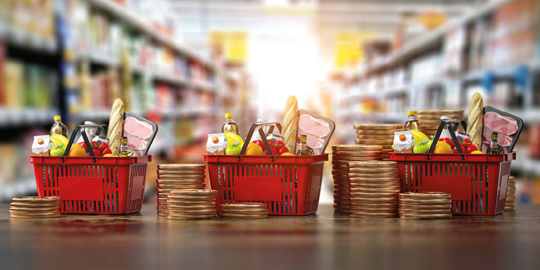 Growth of food sales or growth of market basket or consumer price index concept. Shopping basket with foods with coin stacks in grocery shop. 3d illustration