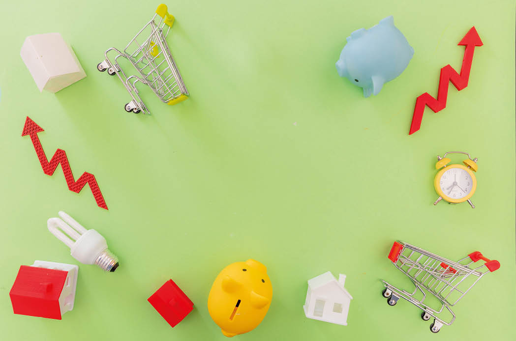 Living cost increase, economic crisis in 2023 flat lay. Shopping cart utilities bills and red rising up arrow on green background.