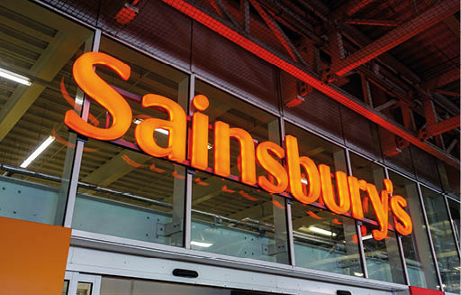 London UK, May 9th 2021: The large orange Sainsbury's supermarket logo sign above the main entrance. Whitechapel, East London branch. Cost of living, inflation, price rise and food shortages. 