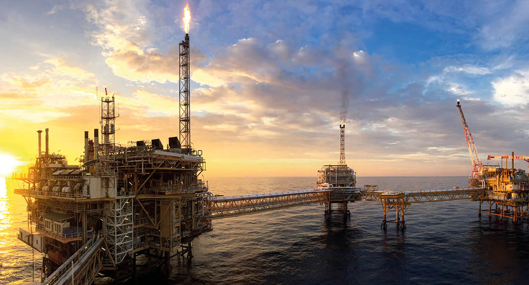 Panorama view of offshore oil and Gas processing platform in sunset time, Concept of exploration and petroleum production industry in the sea.