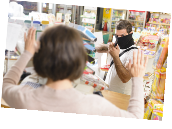 Masked thief pointing a gun to sales woman in a store