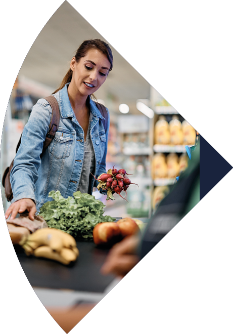 Female supermarket customer paying for goods at the checkout.