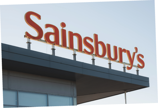 Edinburgh, Scotland - January 6 2021: The Sainbury's logo at Craigleith Retail Park in Edinburgh. Sainsbury's is the UK's second largest supermarket chain.