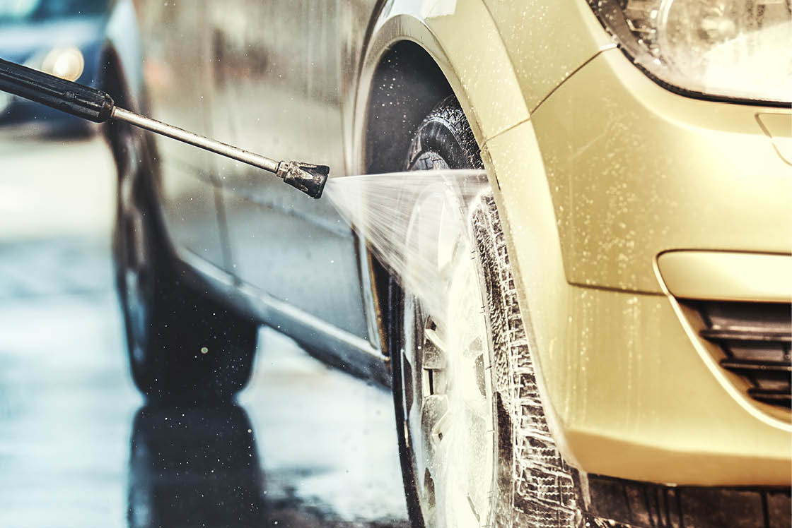 Washing car with soap. Close up concept.
