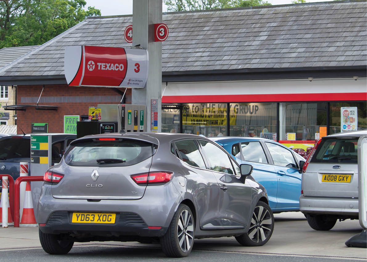 Clitheroe, Lancashire/UK - June 18th 2019: Texaco petrol station with Spar shop and cars at petrol pumps on forecourt