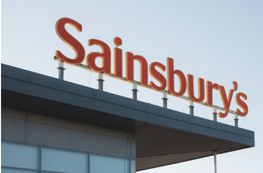 Edinburgh, Scotland - January 6 2021: The Sainbury's logo at Craigleith Retail Park in Edinburgh. Sainsbury's is the UK's second largest supermarket chain.