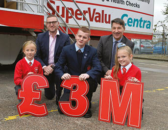 Pictured L-R: Desi Derby, Marketing Director of SuperValu and Centra and Gareth Kirk, CEO of Action Cancer join local schoolchildren Morgan Hall, Niall McCann and Elle Woods to celebrate SuperValu and Centra retailers reaching a landmark fundraising target of  3 million for Action Cancer   one of the largest amounts ever raised by a company for an individual charity in Northern Ireland  The outstanding amount raised will enable Action Cancer to provide life-saving services in local communities through the Big Bus as well as the Health Action Programme (HAP) 