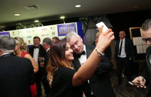 Last years host Eamonn Homles takes a selfie at the 2015 Neighbourhood Retailer Awards